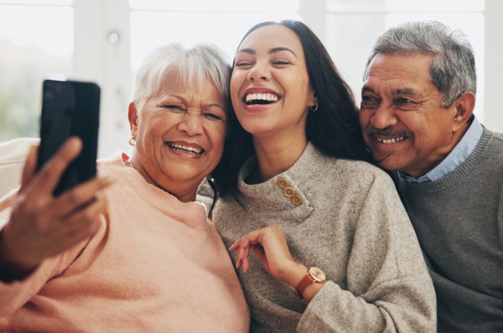 The Gardens of Amarillo | Senior couple laughing with daughter