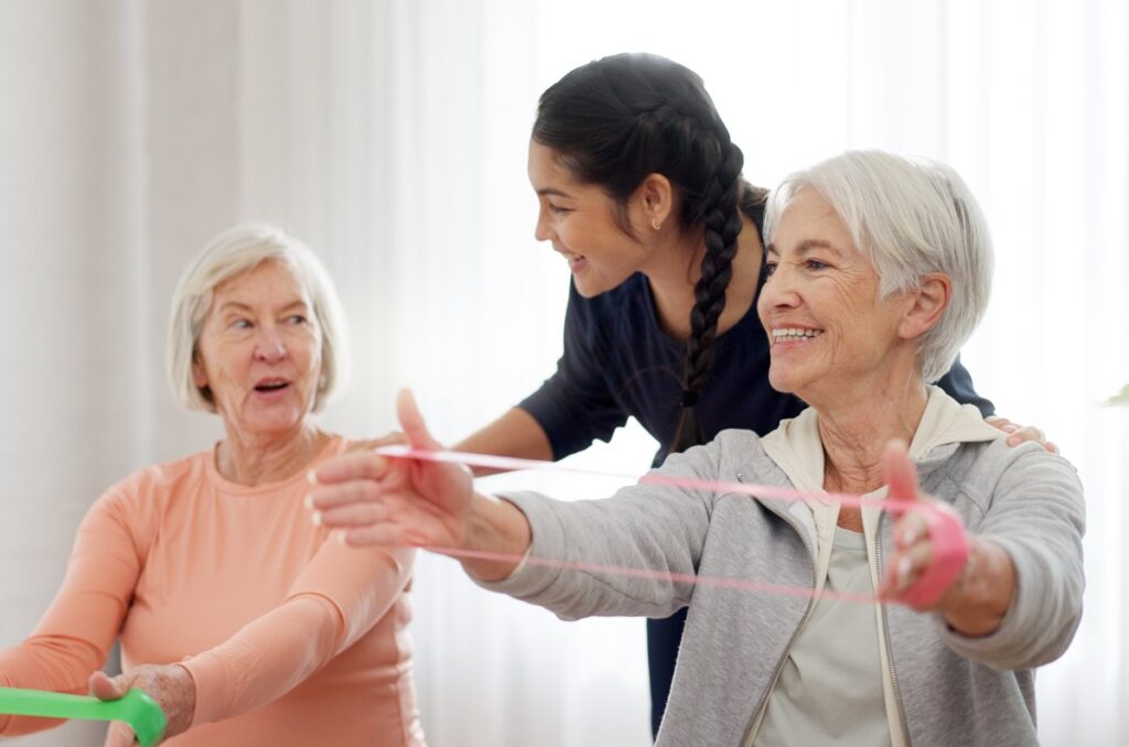 The Gardens of Amarillo | Seniors exercising with a caregiver